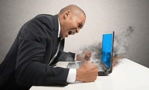 Angry man and laptop on fire